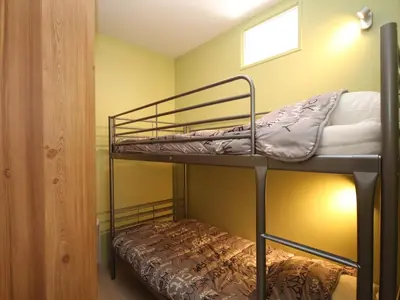 Un ou plusieurs lits dans un hébergement de l'établissement Le Mont-Dore T2 Bis avec Terrasse Ouest et Wi-Fi - FR-1-608-70