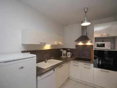 Cuisine ou kitchenette dans l'établissement Le Mont-Dore T2 Bis avec Terrasse Ouest et Wi-Fi - FR-1-608-70