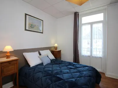 Un ou plusieurs lits dans un hébergement de l'établissement Appartement lumineux T4, proche centre et thermes, La Bourboule - FR-1-608-11