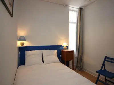 Un ou plusieurs lits dans un hébergement de l'établissement Appartement lumineux T4, proche centre et thermes, La Bourboule - FR-1-608-11