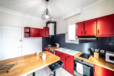 Cuisine ou kitchenette dans l'établissement Le Centre Tenant Éternel - 3 suites