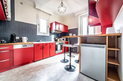 Cuisine ou kitchenette dans l'établissement Le Centre Tenant Éternel - 3 suites