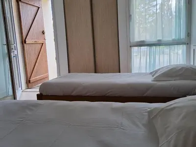 Un ou plusieurs lits dans un hébergement de l'établissement Hôtel Eden Lake