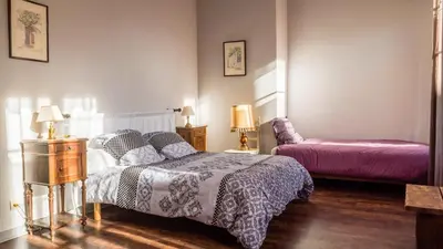 Un ou plusieurs lits dans un hébergement de l'établissement Maison Pierre Loti, gîte historique et spacieux en vallée de la Dordogne