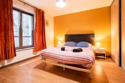 Un ou plusieurs lits dans un hébergement de l'établissement Le LENNON - Centre Ville T2 - Rez-de-chaussée