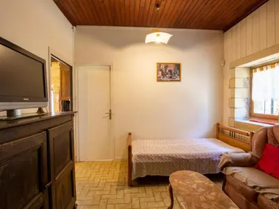 Un ou plusieurs lits dans un hébergement de l'établissement Charmante maison en Dordogne avec jardin et animaux acceptés - FR-1-616-114