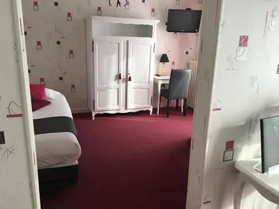 Un ou plusieurs lits dans un hébergement de l'établissement Hôtel Restaurant Le Grillon