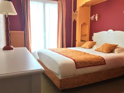 Un ou plusieurs lits dans un hébergement de l'établissement Hôtel Restaurant Le Grillon