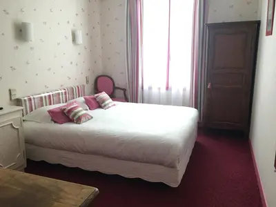 Un ou plusieurs lits dans un hébergement de l'établissement Hôtel Restaurant Le Grillon