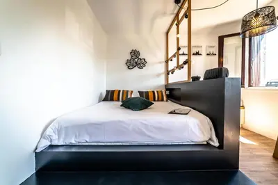 Un ou plusieurs lits dans un hébergement de l'établissement Le Cocon Urbain - 1 Chambre