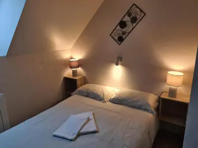 Un ou plusieurs lits dans un hébergement de l'établissement Gite de Murat