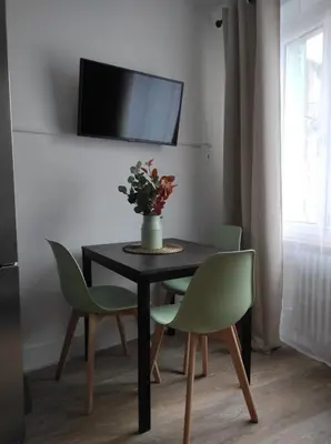 Télévision ou salle de divertissement dans l'établissement L'escapade