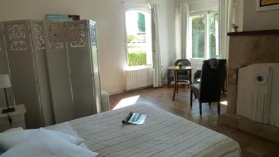 Un ou plusieurs lits dans un hébergement de l'établissement Chambres d'hôtes Le Saleix