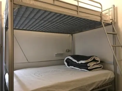 Un ou plusieurs lits dans un hébergement de l'établissement Appartement les Myrtilles à Super Besse au pied des pistes
