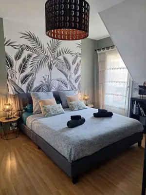 Un ou plusieurs lits dans un hébergement de l'établissement Chambre climatisée au cœur de brive avec téléviseur connecté wifi Netflix