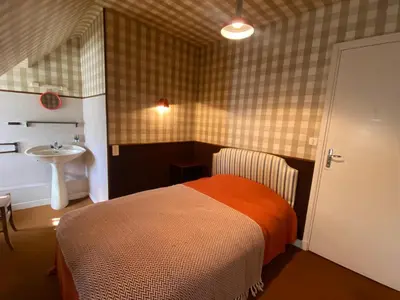 Un ou plusieurs lits dans un hébergement de l'établissement Hôtel de famille L.F.M.A.L.