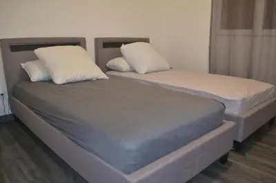 Un ou plusieurs lits dans un hébergement de l'établissement Maison Cinona
