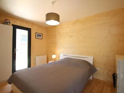 Un ou plusieurs lits dans un hébergement de l'établissement Chalet moderne 92m², Wi-Fi, proche Mont-Dore - FR-1-608-206