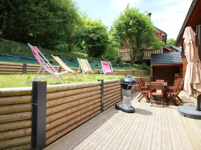 Jardin de l'établissement Chalet moderne 92m², Wi-Fi, proche Mont-Dore - FR-1-608-206
