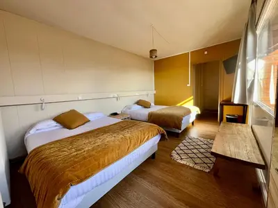 Un ou plusieurs lits dans un hébergement de l'établissement Hotel Perdrix