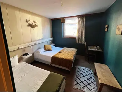Un ou plusieurs lits dans un hébergement de l'établissement Hotel Perdrix