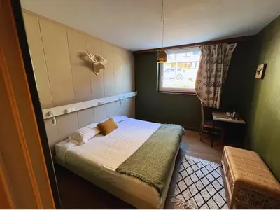 Un ou plusieurs lits dans un hébergement de l'établissement Hotel Perdrix