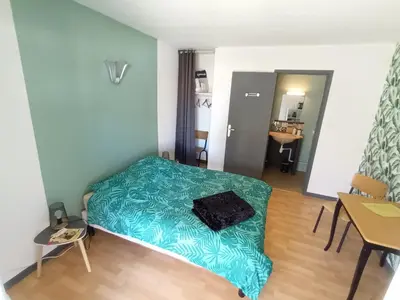 Un ou plusieurs lits dans un hébergement de l'établissement Le Miraillet, chambre hôte