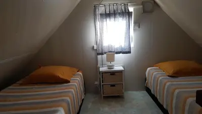 Un ou plusieurs lits dans un hébergement de l'établissement COTTAGE - Lac du Causse