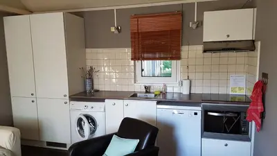 Cuisine ou kitchenette dans l'établissement COTTAGE - Lac du Causse