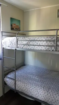 Un ou plusieurs lits dans un hébergement de l'établissement COTTAGE - Lac du Causse
