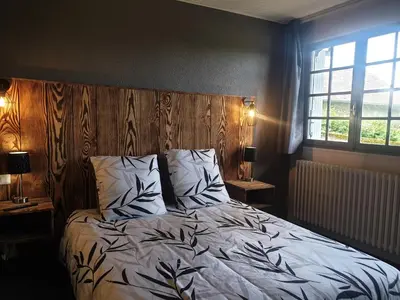 Un ou plusieurs lits dans un hébergement de l'établissement Auberge du Bois de l'étang - Motel les Tilleuls