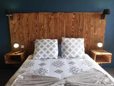 Un ou plusieurs lits dans un hébergement de l'établissement Auberge du Bois de l'étang - Motel les Tilleuls