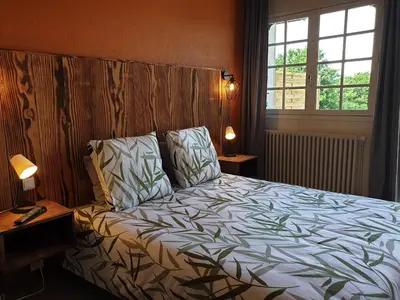 Un ou plusieurs lits dans un hébergement de l'établissement Auberge du Bois de l'étang - Motel les Tilleuls