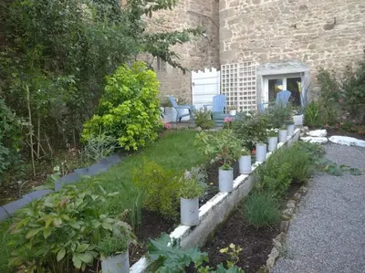 Jardin de l'établissement Appartement rouge avec jardin