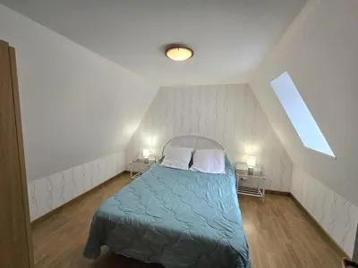Un ou plusieurs lits dans un hébergement de l'établissement Charmante maison individuelle avec terrasse et BBQ en Dordogne, animaux acceptés - FR-1-616-185