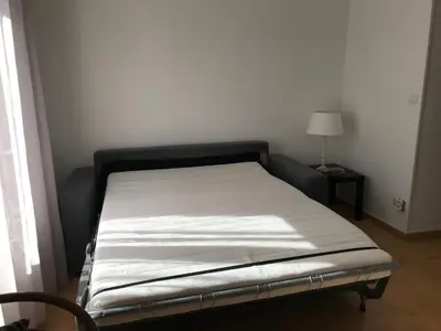Un ou plusieurs lits dans un hébergement de l'établissement Grand Studio Manon en coeur de ville pour 2 p