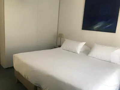 Un ou plusieurs lits dans un hébergement de l'établissement Appartement Marion en coeur de ville 2 à 4 personnes