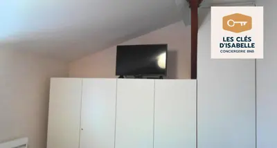 Télévision ou salle de divertissement dans l'établissement Maison entière feytiat