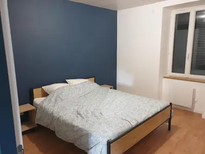 Un ou plusieurs lits dans un hébergement de l'établissement Gîte Lepetit Sabotier grande capacité Puy de Dôme
