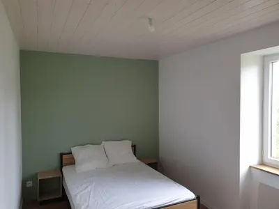 Un ou plusieurs lits dans un hébergement de l'établissement Gîte Lepetit Sabotier grande capacité Puy de Dôme