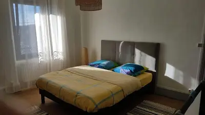 Un ou plusieurs lits dans un hébergement de l'établissement Résidence de Suzanne Gîte avec sauna privatif