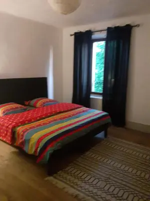 Un ou plusieurs lits dans un hébergement de l'établissement Résidence de Suzanne Gîte avec sauna privatif