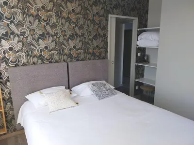 Un ou plusieurs lits dans un hébergement de l'établissement Logis Hôtel Restaurant Cruzel