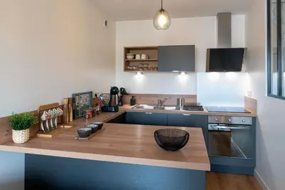 Cuisine ou kitchenette dans l'établissement L'Instant Terrasse - 1 Chambre