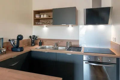 Cuisine ou kitchenette dans l'établissement L'Instant Terrasse - 1 Chambre