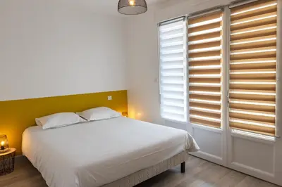 Un ou plusieurs lits dans un hébergement de l'établissement Le Rooftop Briviste - 2 Chambres