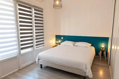 Un ou plusieurs lits dans un hébergement de l'établissement Le Rooftop Briviste - 2 Chambres