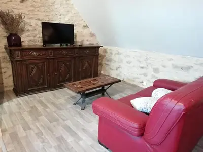 Télévision ou salle de divertissement dans l'établissement Le Fenil