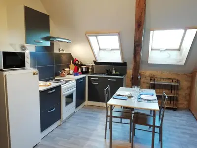 Cuisine ou kitchenette dans l'établissement Le Fenil