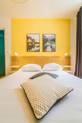 Un ou plusieurs lits dans un hébergement de l'établissement Le Contemporain - 1 Chambre